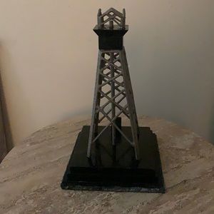 Antique metal oil derrick with marble base